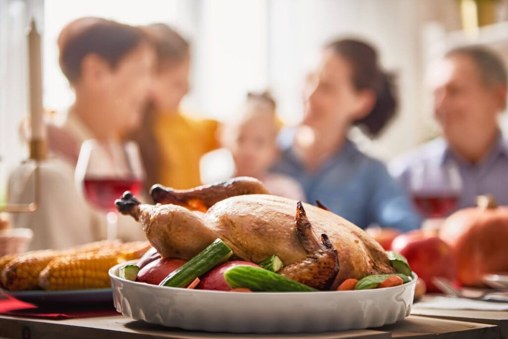 A family sharing support for each other over a Thanksgiving meal thanks to family therapy.